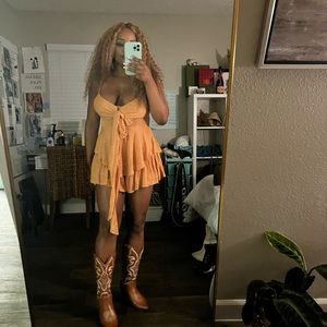 Apricot colored ruffled look tie up dress with thin straps